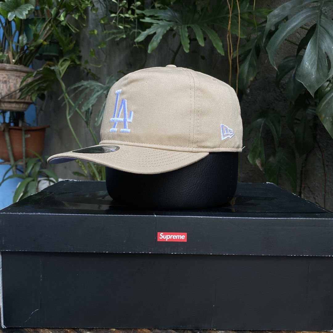 New Era LA Dodgers The Golfer Snapback Cap (Category: Caps & Hats) located in Manila. Submitted by jpdavidso (Listing ID 1424546430, Image 2). Description: - New Era LA Dodgers snapback cap - 'The Golfer' style - Tan color - White embroidery - White underbrim - Black interior - One size fits most.