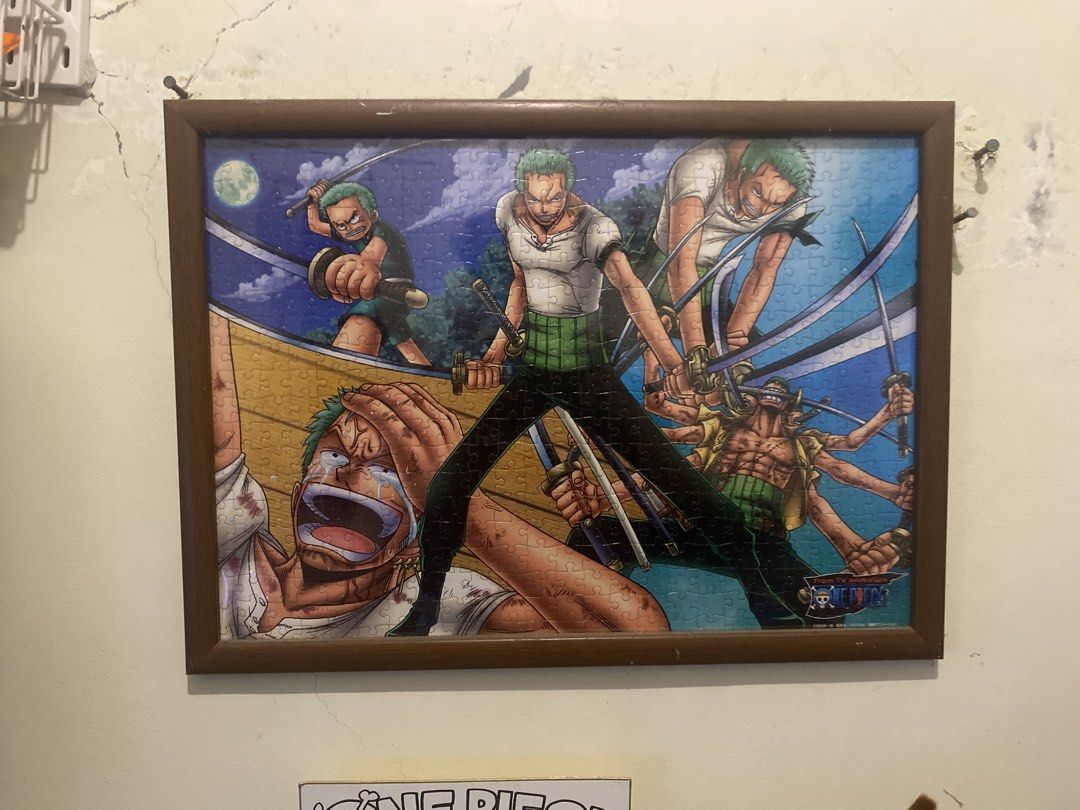 One Piece Zoro Puzzle FRAME (Category: Art & Prints) located in Manila. Submitted by ejothegod (Listing ID 1424605837, Image 1). Description: For sale 1k only rush - Framed One Piece puzzle featuring Zoro. - From the TV animation series. - Wooden frame included. - Depicts Zoro in action poses. - Complete puzzle..