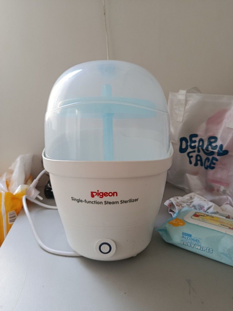 Pigeon Single-function Steam Sterilizer (Category: Breastfeeding & Bottle Feeding) located in Marikina City. Submitted by cblakes (Listing ID 1424597960, Image 1). Description: - Pigeon single-function steam sterilizer - White base with blue top and clear lid - In good working condition - Features a power button and cord super super like new po I barely used this. .