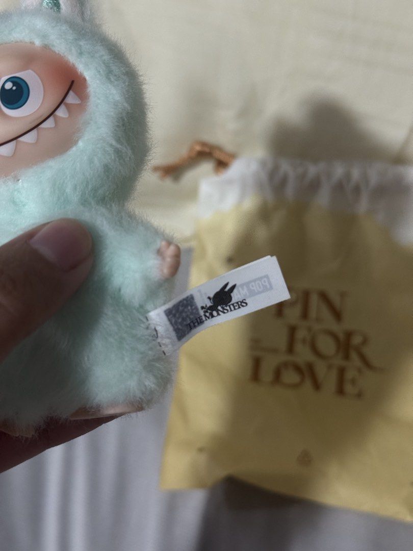 POP MART The Monsters Pin For Love (Category: Designer & Blind Box Toys) located in Valenzuela. Submitted by danabananani (Listing ID 1424627471, Image 3). Description: - POP MART The Monsters Pin For Love plush toy - Cute monster design - Mint green, fluffy exterior - Comes with original drawstring bag and tag - Perfect for collectors or gifts - RFS: Not prio color/letter.