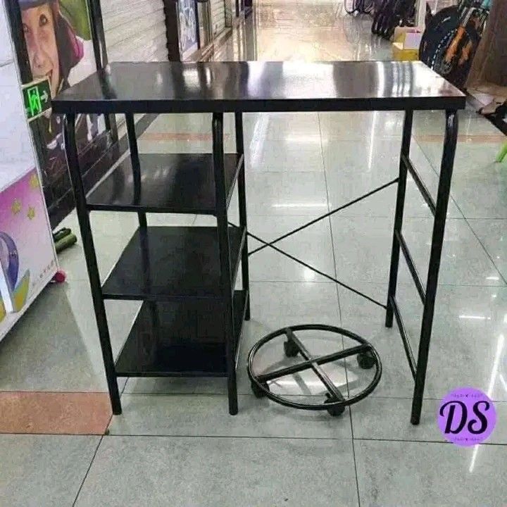 Portable Kitchen Cart with Gas Stove (Category: Other Kitchenware & Tableware) located in Makati City. Submitted by oideme (Listing ID 1424641766, Image 2). Description: - Portable kitchen cart - Built-in gas stove - Shelves for storage - Space for gas tank - Black metal construction - Ideal for small spaces and outdoor use - Simple and functional design.