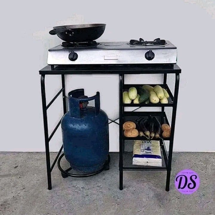 Portable Kitchen Cart with Gas Stove (Category: Other Kitchenware & Tableware) located in Makati City. Submitted by oideme (Listing ID 1424641766, Image 1). Description: - Portable kitchen cart - Built-in gas stove - Shelves for storage - Space for gas tank - Black metal construction - Ideal for small spaces and outdoor use - Simple and functional design.