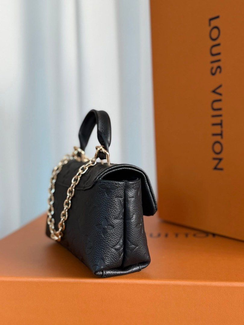 Preloved Mini Dauphine Handbag (Category: Luxury Bags & Wallets) located in Manila. Submitted by bagsandshoesmanymore (Listing ID 1424532256, Image 3). Description: -Preloved Mini Dauphine -Size 19cm - Crafted from black embossed leather - Top handle and detachable chain strap - Gold-tone clasp closure - Interior: Main compartment and slip pocket - Marked "Louis Vuitton Paris made in France".