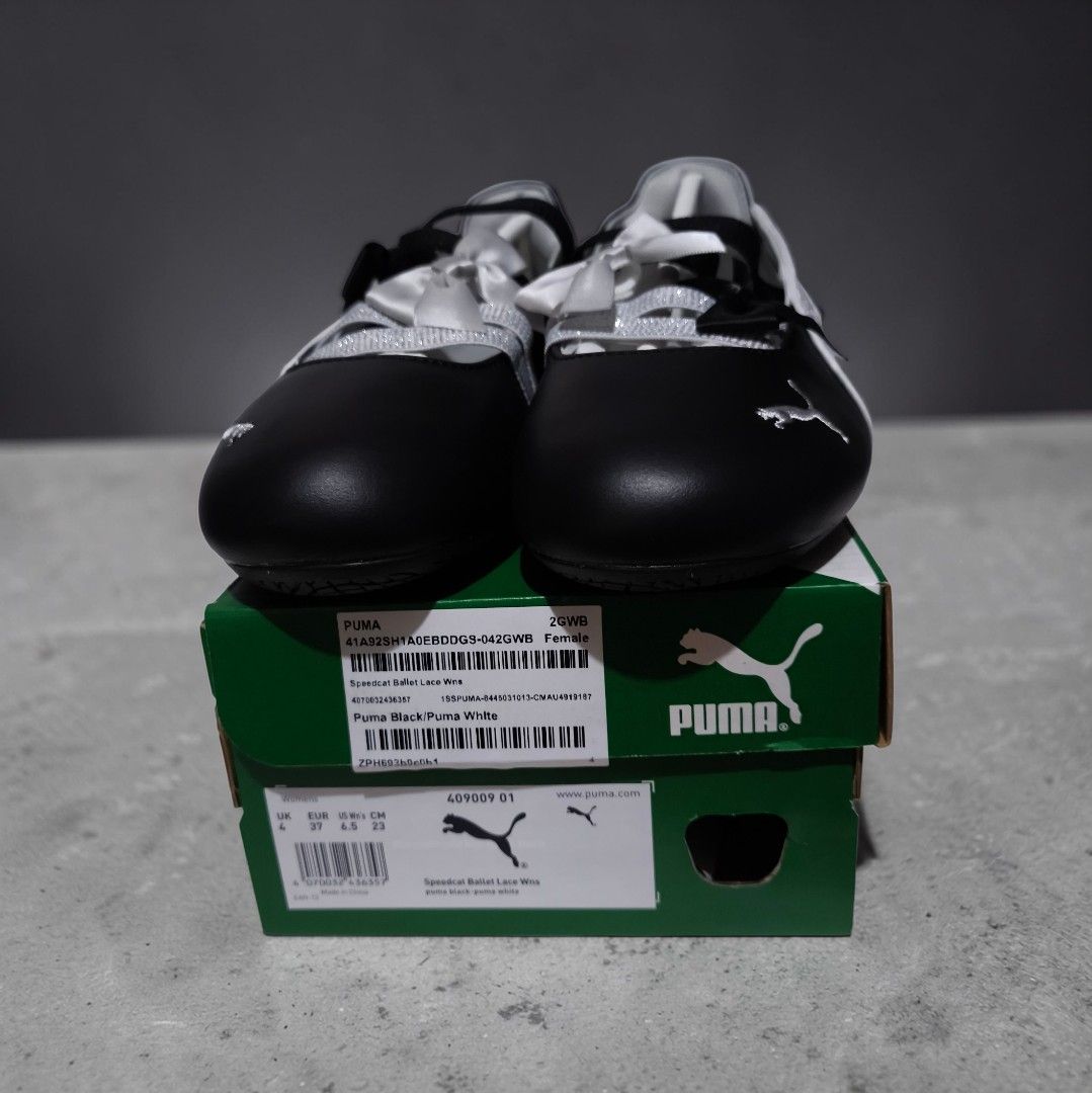 Puma Ballet Flats lace Black/White US 6.5 (Category: Flats & Sandals) located in Quezon City. Submitted by wcfhomeandoffice (Listing ID 1424683884, Image 2). Description: Elegant Puma ballet flats in black and white. Features a bow detail and Puma logo. The shoes come with their original box. The size is indicated on the box. A stylish choice for any occasion..