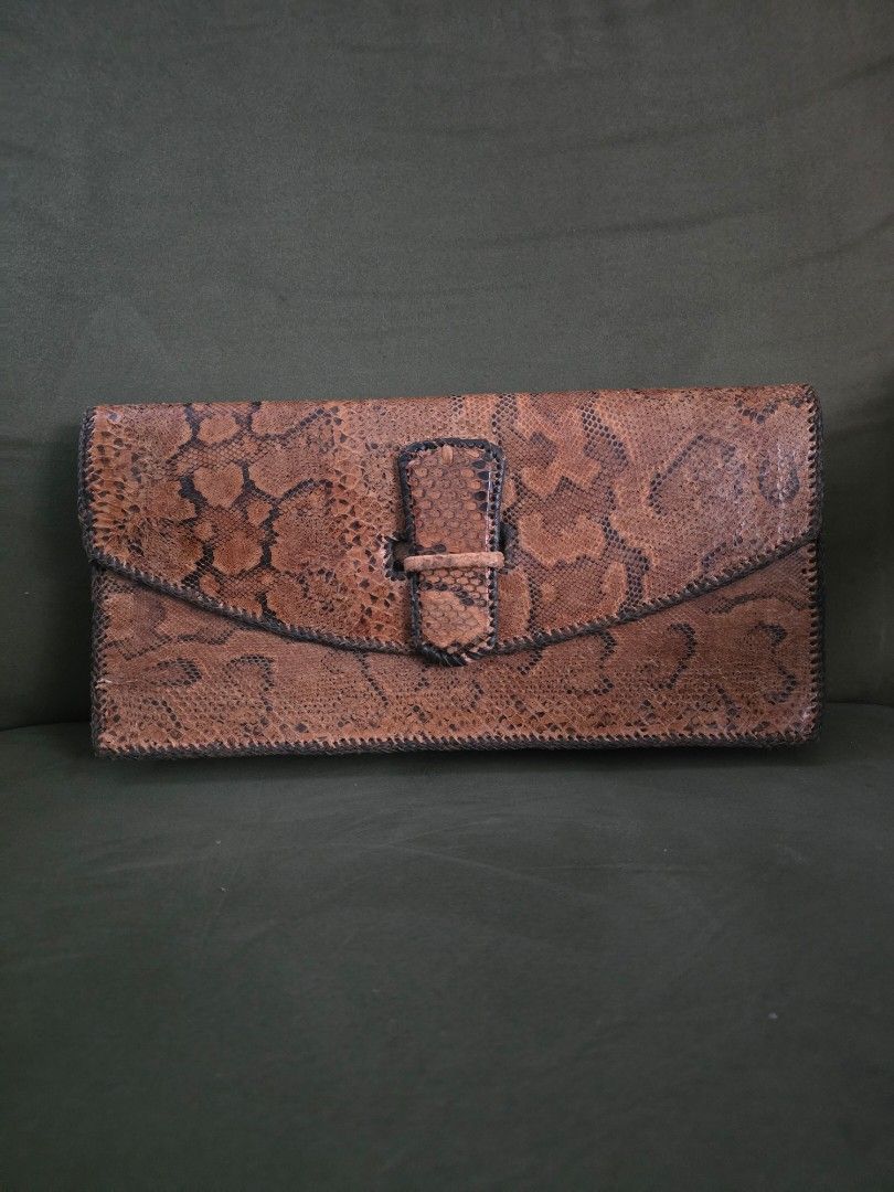 Python Skin Clutch bag (Category: Luxury Bags & Wallets) located in Davao. Submitted by moodsale (Listing ID 1424701795, Image 1). Description: Genuine snake skin phyton clutch bag. Inside of the bag is also leather.