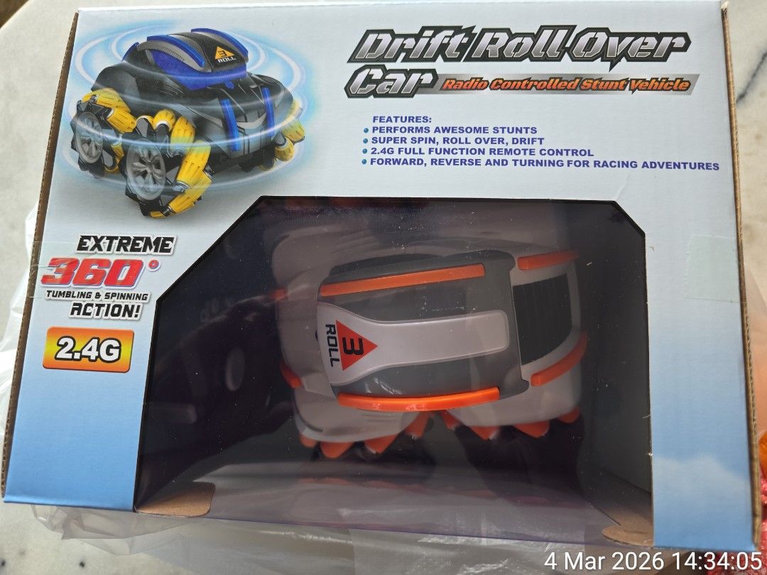 Remote control car (Category: Remote Control Toys) located in Singapore. Submitted by whyisskyblue (Listing ID 1424597607, Image 2). Description: Drift Roll Over Car, a radio-controlled stunt vehicle. Key features and specifications include: Action: Performs 360-degree tumbling, spinning, and drifting stunts. Control: Operates via a 2.4G full-function remote control. Mobility: Engineered for forward, reverse, and turning motions. Power: Typically