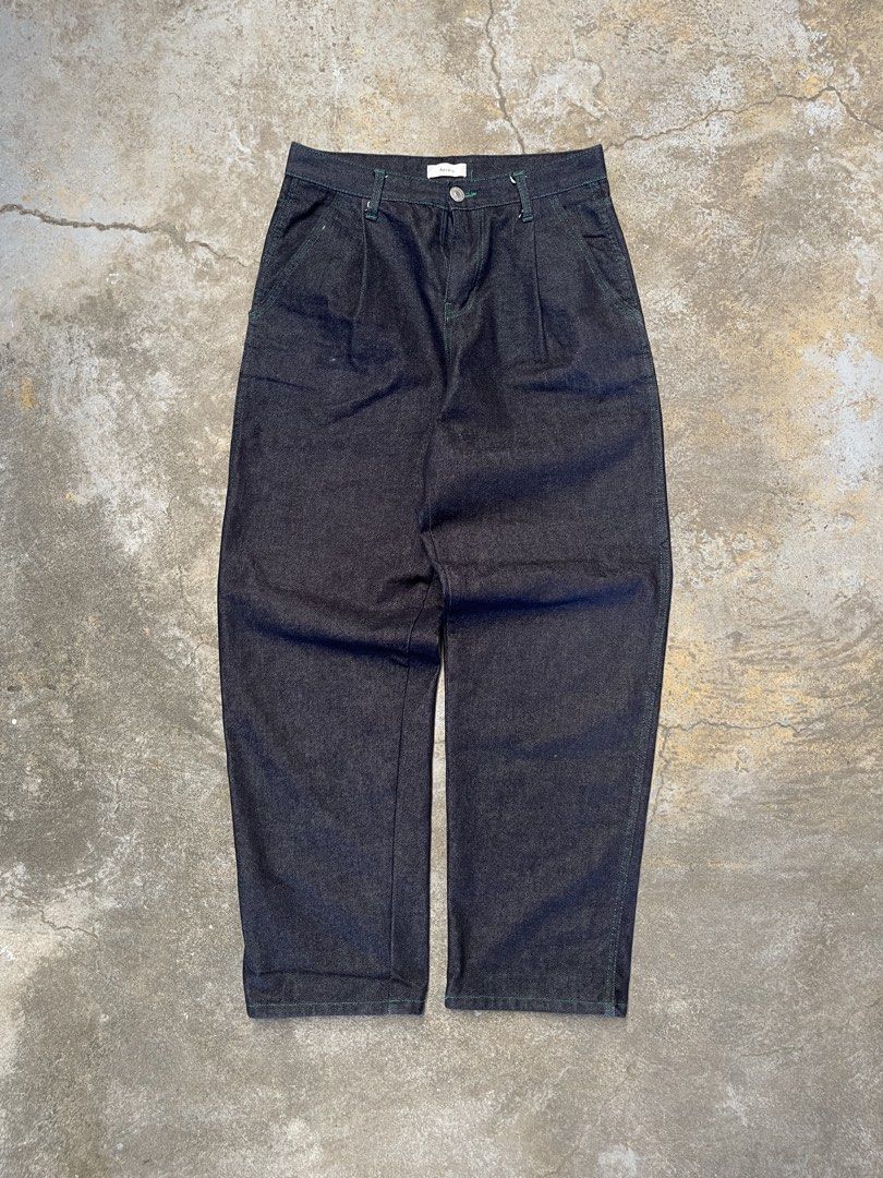 Revere Dark Wash Jeans (Category: Jeans) located in Bulacan. Submitted by archivesgallery_ (Listing ID 1424601278, Image 1). Description: -Raw Denim Pleated jeans -Measurements Waist: 31 Rise: 12.5 Length: 40.5 Leghole: 8.5 Thigh: 11.5 - Green stitching details - Button closure - Pleats at the front - Two front and two back pockets - Straight leg fit.