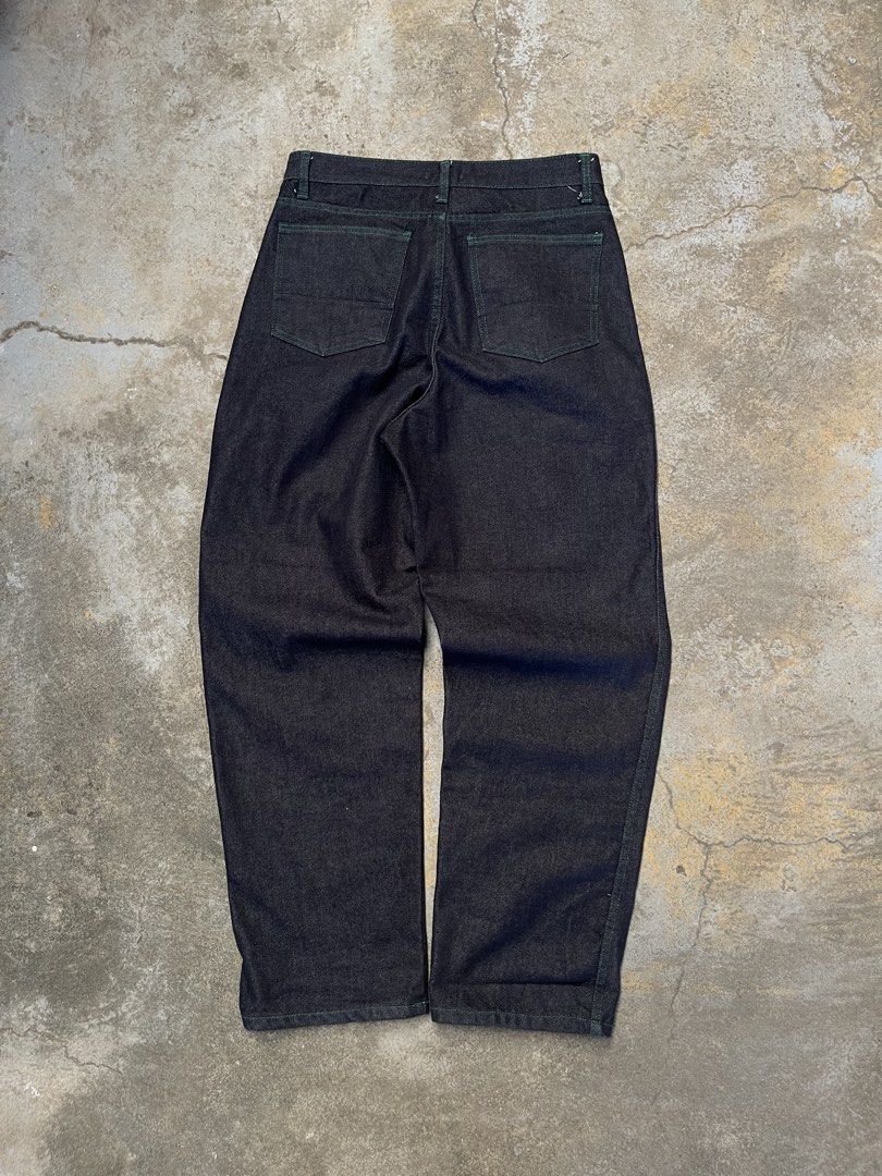 Revere Dark Wash Jeans (Category: Jeans) located in Bulacan. Submitted by archivesgallery_ (Listing ID 1424601278, Image 2). Description: -Raw Denim Pleated jeans -Measurements Waist: 31 Rise: 12.5 Length: 40.5 Leghole: 8.5 Thigh: 11.5 - Green stitching details - Button closure - Pleats at the front - Two front and two back pockets - Straight leg fit.