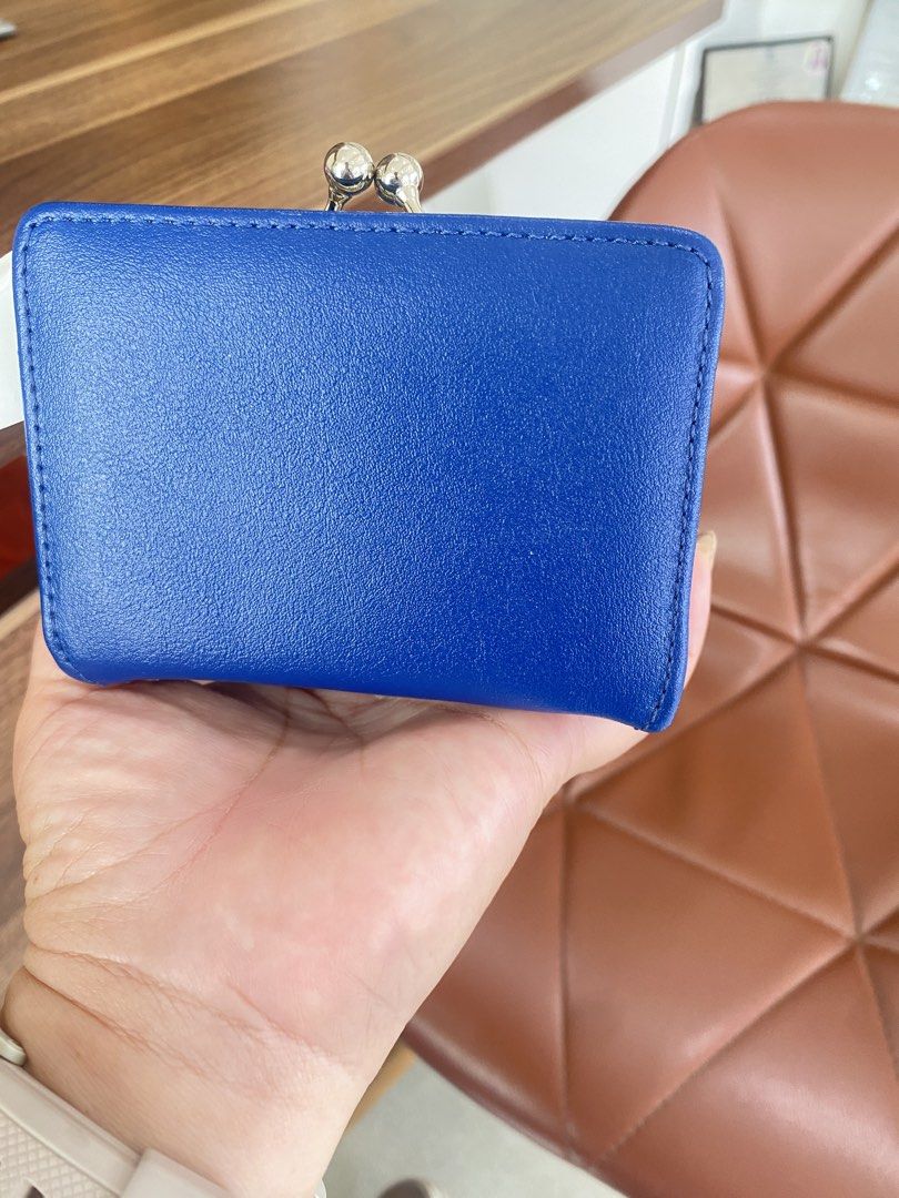 Rodeo Crowns Blue and Orange Wallet (Category: Wallets & Card holders) located in Guiuan. Submitted by obladi_oblada (Listing ID 1424537464, Image 3). Description: - Like new Rodeo Crowns wallet - Eye-catching blue and orange color scheme - Features the Rodeo Crowns logo - Secure clasp closure - Multiple compartments for cards and cash - Includes card slots and a coin compartment - Compact and easy to carry.