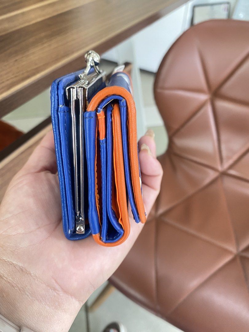 Rodeo Crowns Blue and Orange Wallet (Category: Wallets & Card holders) located in Guiuan. Submitted by obladi_oblada (Listing ID 1424537464, Image 2). Description: - Like new Rodeo Crowns wallet - Eye-catching blue and orange color scheme - Features the Rodeo Crowns logo - Secure clasp closure - Multiple compartments for cards and cash - Includes card slots and a coin compartment - Compact and easy to carry.