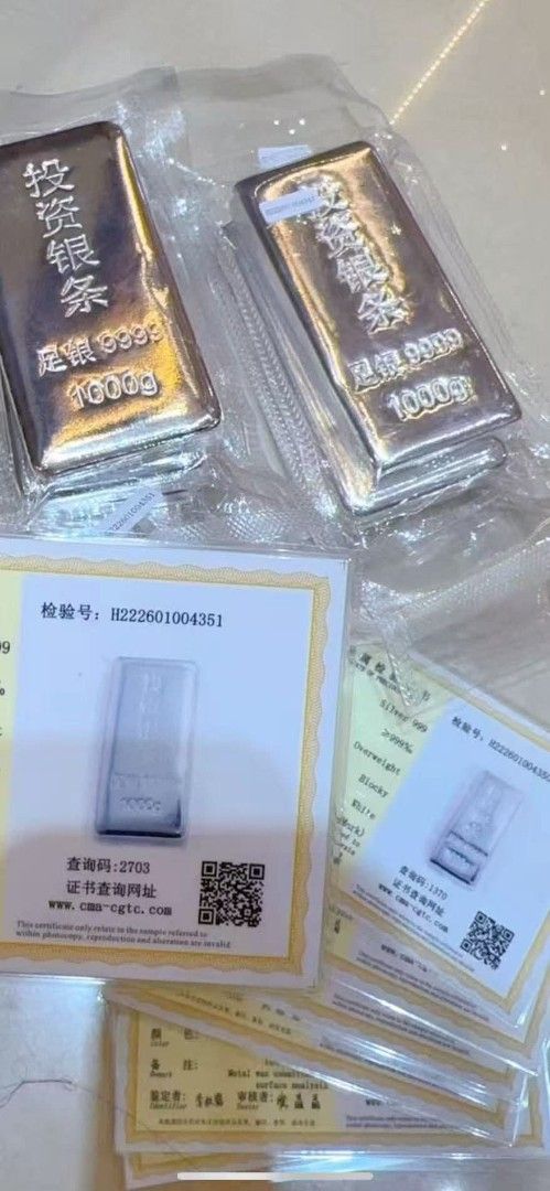 Silver Bars 50g/100g/1000g (Category: Currency) located in Manila. Submitted by primejewelry (Listing ID 1424529413, Image 3). Description: Silver bars available in various weights: 50g, 100g, and 1000g. The bars are marked with Chinese characters and the purity of 999.9. Some bars are in individual protective cases, while others are sealed in plastic. The brand name "Song Da Sheng" is visible on some of the 1000g bars..