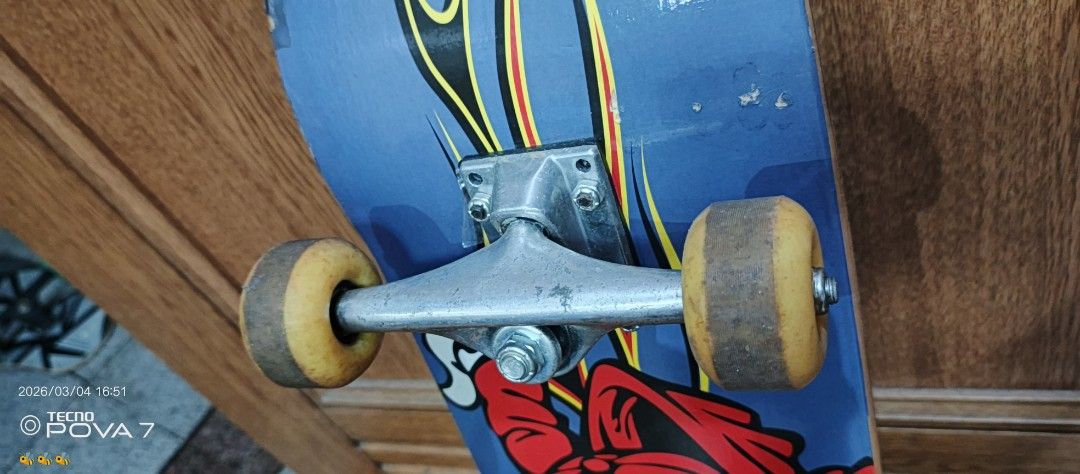Skateboard with Graphic Design (Category: Skates, Rollerblades & Scooters) located in Manila. Submitted by jhaylex_0422 (Listing ID 1424608705, Image 2). Description: Skateboard features a vibrant graphic design on the deck. It has silver trucks and yellow wheels. The deck shows some wear and tear. It is suitable for recreational use. The wheels appear to be in good shape..