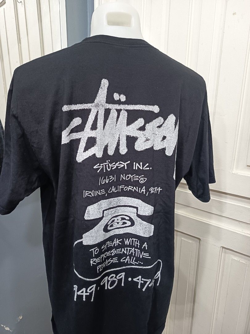 Stussy Black Graphic Tee - Size L (Category: Tshirts & Polo Shirts ) located in Cagayan de Oro. Submitted by chloedime (Listing ID 1424572941, Image 2). Description: - Stussy t-shirt - Size: Large - Front: White logo - Back: Graphic with Stussy Inc. address and phone design - Material: 100% Cotton - Made in Honduras.