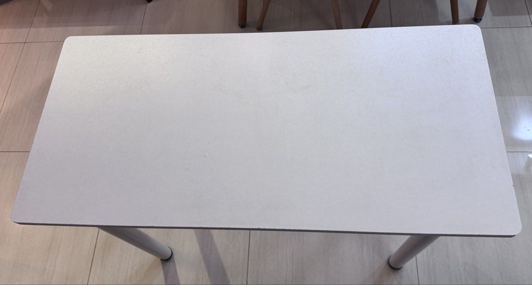 Table (Category: Tables & Sets) located in Singapore. Submitted by zzhizzhong (Listing ID 1372131994, Image 3). Description: This functional table is an ideal choice for compact spaces such as home offices, study rooms, or small dining areas. For convenience and ease of assembly, the table features legs with detachable screws, allowing for quick setup and disassembly. Measurement: 100 cm in length, 48 cm in width, and 75 cm in height.