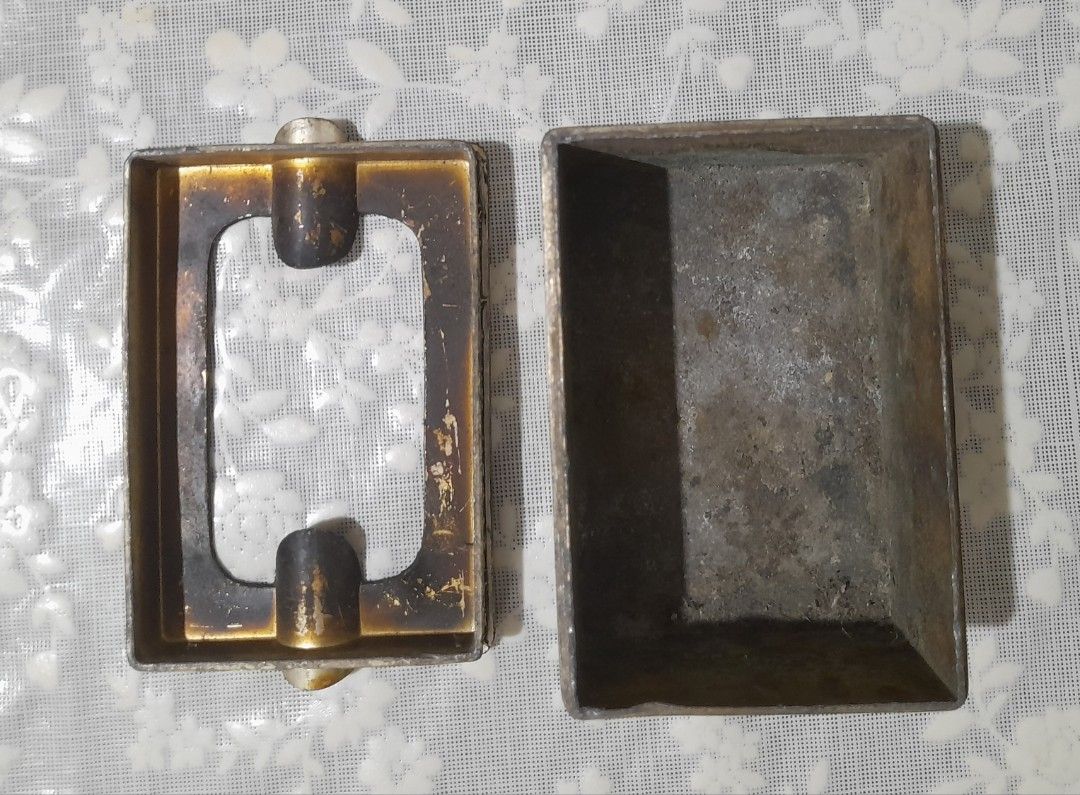 Vintage Metal Ashtray and Cigarette Case Set (Category: Vintage Collectibles) located in Manila. Submitted by miamiga (Listing ID 1424618210, Image 3). Description: - Features a unique textured design - Includes both an ashtray and a cigarette case. - Aged appearance with signs of usage, showing signs of vintage charm. - The cigarette case has a gold interior to prevent the metal from reacting with the cigarette. - Perfect for collectors or those