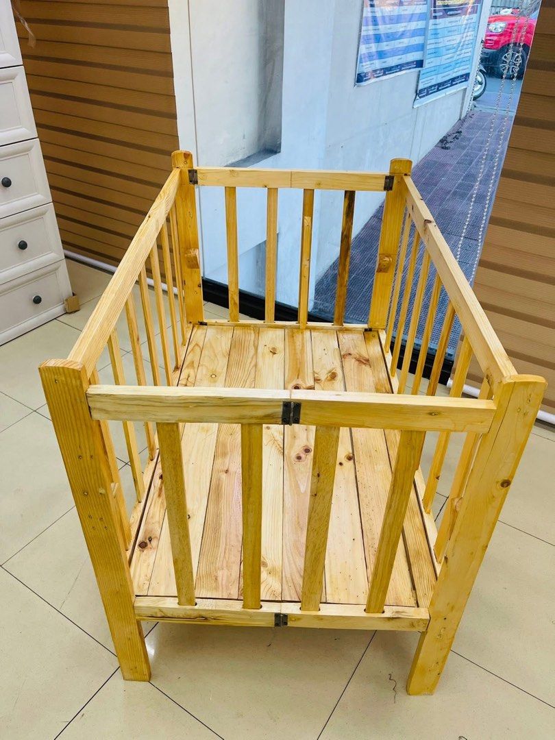 Wooden Baby Crib with Bedding (Category: Cots & Cribs) located in Las Pinas. Submitted by shytorres (Listing ID 1424534047, Image 3). Description: Handcrafted wooden baby crib. Includes a wooden frame with a slatted base and sides. Comes with a fitted sheet. Several bedding designs are available, including Cinnamoroll, dinosaurs, and hearts. The crib is designed for a baby's comfort and safety. Perfect for your little one!.