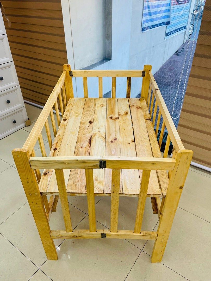 Wooden Baby Crib with Bedding (Category: Cots & Cribs) located in Las Pinas. Submitted by shytorres (Listing ID 1424534047, Image 1). Description: Handcrafted wooden baby crib. Includes a wooden frame with a slatted base and sides. Comes with a fitted sheet. Several bedding designs are available, including Cinnamoroll, dinosaurs, and hearts. The crib is designed for a baby's comfort and safety. Perfect for your little one!.