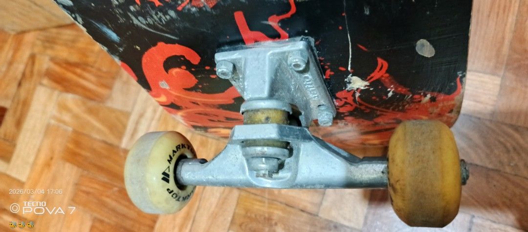 Xiao Chu Skateboard (Category: Skates, Rollerblades & Scooters) located in Manila. Submitted by jhaylex_0422 (Listing ID 1424606440, Image 2). Description: Skateboard features a black deck with red and orange graphics. It has silver trucks and yellow wheels. The deck has some wear and tear. The brand name "Xiao Chu" is visible on the deck. The wheels have "TOP MARK" printed on them..
