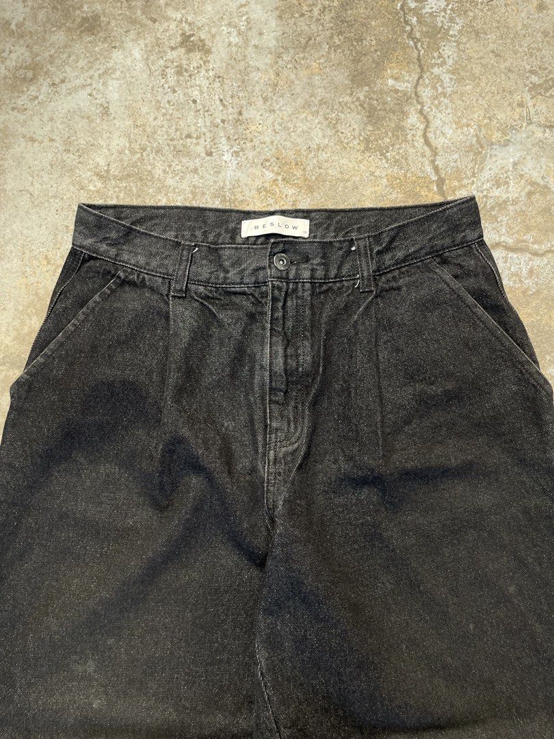 Y2k Beslow Black Raw Pleated Jeans (Category: Jeans) located in Bulacan. Submitted by archivesgallery_ (Listing ID 1424601273, Image 3). Description: Black Beslow jeans. Features a relaxed fit with a pleated front design. Includes two front pockets and two back pockets. The Beslow brand tag is visible at the back. The jeans have a straight leg cut. -Measurements Waist: 30-31 Rise: 11.5 Length: 38 Leghole: 9 Thigh: 13 .
