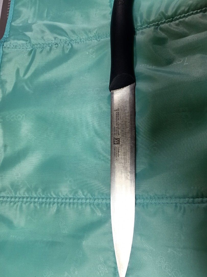 Zwilling j.a henckel (Category: Knives & Chopping Boards) located in Pasig City. Submitted by urdal01 (Listing ID 1424640358, Image 1). Description: - Zwilling J.A. Henckels knife. - Features a stylish black handle. - Known for its high-quality blade. - A great addition to any kitchen..