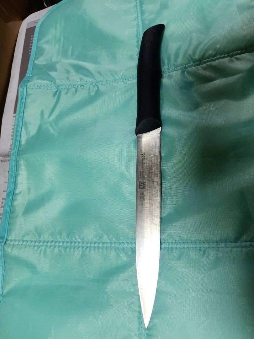 Zwilling j.a henckel (Category: Knives & Chopping Boards) located in Pasig City. Submitted by urdal01 (Listing ID 1424640358, Image 2). Description: - Zwilling J.A. Henckels knife. - Features a stylish black handle. - Known for its high-quality blade. - A great addition to any kitchen..