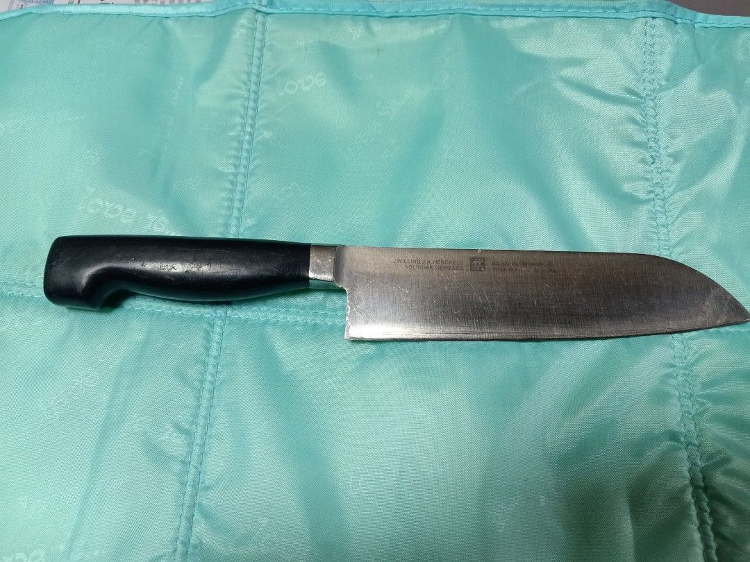 Zwilling j.a henckels (Category: Knives & Chopping Boards) located in Pasig City. Submitted by urdal01 (Listing ID 1424640617, Image 1). Description: - Zwilling J.A. Henckels knife - Features a black handle - Ideal for kitchen use.