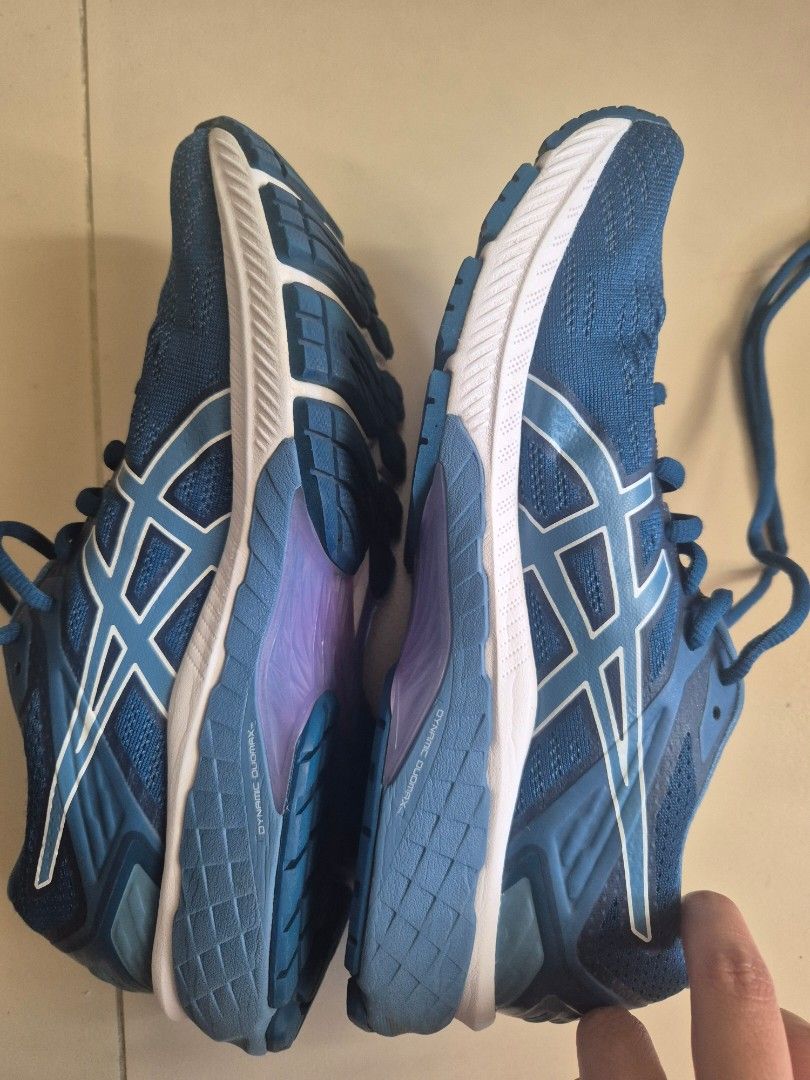 Asics Gel-Cumulus 22 Running Shoes (Category: Sneakers) located in Quezon City. Submitted by _jc.u_ (Listing ID 1424741199, Image 3). Description: Asics Gel-Cumulus 22 running shoes in blue. Features the Asics logo on the side and tongue. The sole has a white and blue design with visible cushioning technology. The shoes show minimal wear on the soles. Size is indicated as EUR 39, US 7.5..