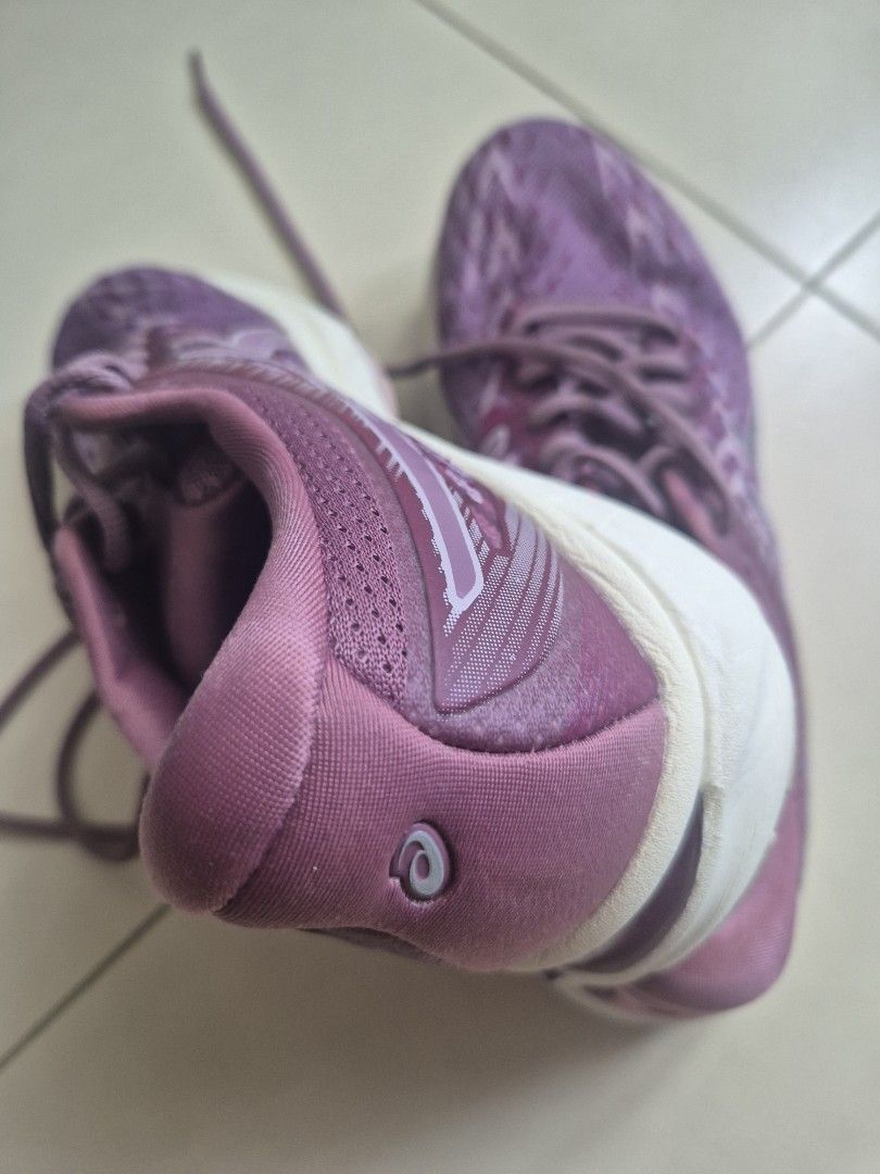Asics GT-2000 9 Running Shoes (Category: Sneakers) located in Quezon City. Submitted by _jc.u_ (Listing ID 1424741662, Image 2). Description: Asics GT-2000 9 running shoes in purple. Features a breathable upper and a durable rubber sole. The size is US 7.5, EUR 39, and 24.5 cm. The shoes have a lace-up closure. The soles show some signs of wear. Made in Vietnam..