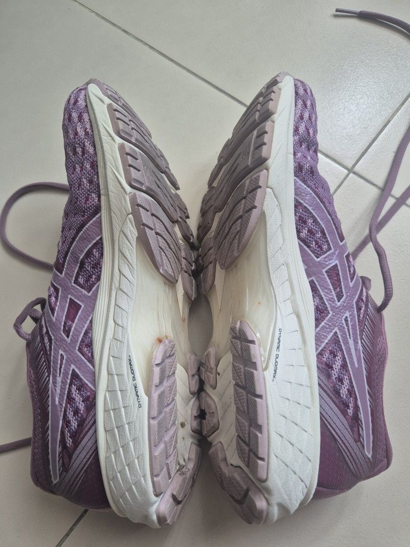 Asics GT-2000 9 Running Shoes (Category: Sneakers) located in Quezon City. Submitted by _jc.u_ (Listing ID 1424741662, Image 3). Description: Asics GT-2000 9 running shoes in purple. Features a breathable upper and a durable rubber sole. The size is US 7.5, EUR 39, and 24.5 cm. The shoes have a lace-up closure. The soles show some signs of wear. Made in Vietnam..