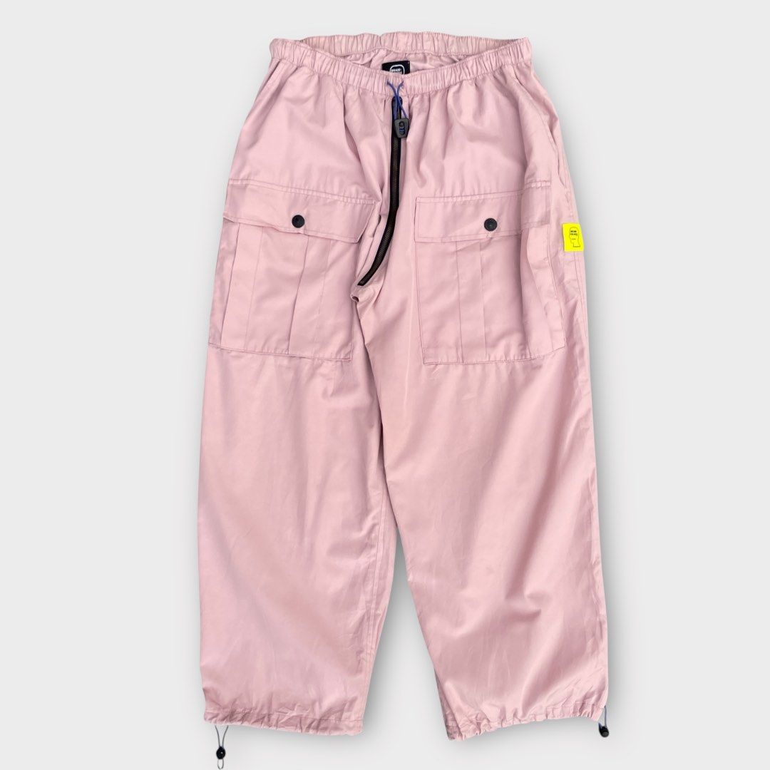 Brain Dead - Nylon Flight Cargo Pants Pink (Category: Activewear) located in Los Banos. Submitted by declutterking (Listing ID 1424867290, Image 2). Description: Size Medium on tag (30-32 waist) Poly blend cargo pants featuring two large front pockets and two hand pockets, elastic drawcord waist, and drawcord hems. Dimensions: 14.75" waist 13.25" front rise 15" thigh 35.5" length 9.25" leg opening Good as new condition Authentic.