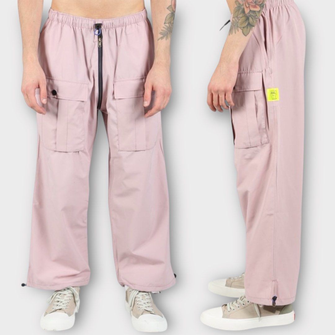 Brain Dead - Nylon Flight Cargo Pants Pink (Category: Activewear) located in Los Banos. Submitted by declutterking (Listing ID 1424867290, Image 1). Description: Size Medium on tag (30-32 waist) Poly blend cargo pants featuring two large front pockets and two hand pockets, elastic drawcord waist, and drawcord hems. Dimensions: 14.75" waist 13.25" front rise 15" thigh 35.5" length 9.25" leg opening Good as new condition Authentic.
