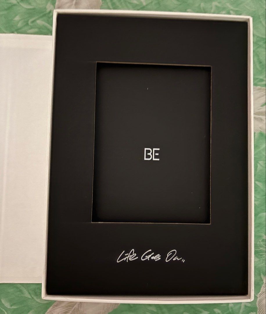 BTS BE Deluxe Edition Album (Category: CDs & DVDs) located in Panabo. Submitted by taecompli (Listing ID 1424792326, Image 2). Description: - Includes photobook, CD, making book, lyric poster, photo frame, 7 postcards, and poster -Section of the photobook became detached - Unsealed.