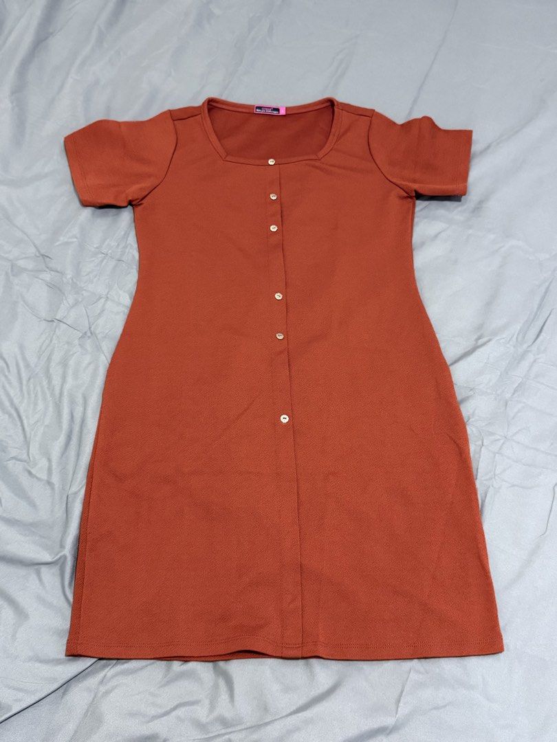 Button-Down Dress (Category: Dresses) located in Mansalay. Submitted by declutterandco (Listing ID 1424802667, Image 2). Description: Dress features a button-down design and short sleeves. It has a square neckline and a slit at the bottom. It is a knee-length dress..