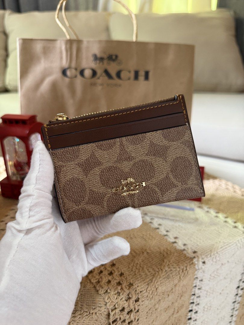 Coach Card Holder with Zipper (Category: Luxury Bags & Wallets) located in Angeles City. Submitted by luckymiaa (Listing ID 1424768362, Image 3). Description: Coach Skinny Wallet 100% Original from US Colors Available: Tan Brown, Taupe Cream, Black Location: Pampanga Courier: Lalamove, J&T, LBC .