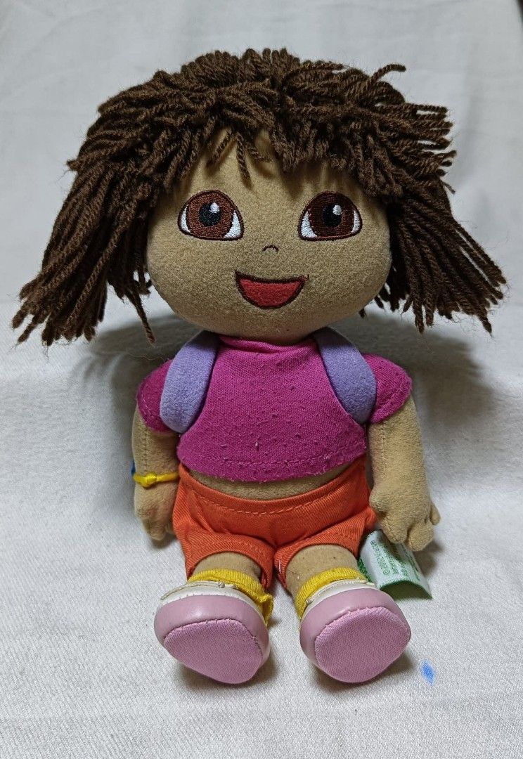 Dora the Explorer Plush Doll (Category: Plushies & Soft Toys) located in Baguio. Submitted by boxmania (Listing ID 1424731295, Image 1). Description: Plush - Dora the Explorer From HK/UK/Dubai/Canada or Japan Surplus Box What you see is what you get No return, no exchange (random item po nakukuha ng seller sa box).