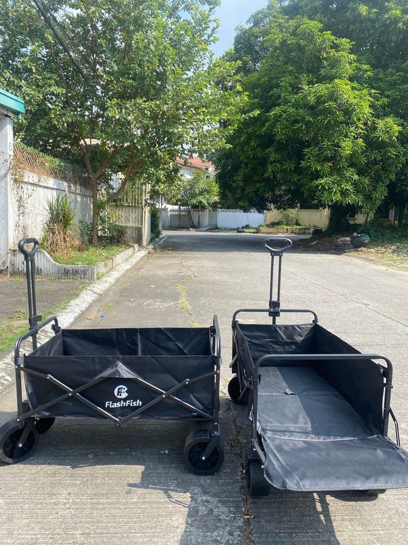 FlashFish Folding Wagon (Category: Strollers) located in Las Pinas. Submitted by shytorres (Listing ID 1424747501, Image 3). Description: Durable FlashFish folding wagon, perfect for carrying items. Features a sturdy frame and a foldable design for easy storage. The wagon has a black fabric bed and a pull handle for easy maneuverability. It also has a side that can be folded down. Comes with its original box..
