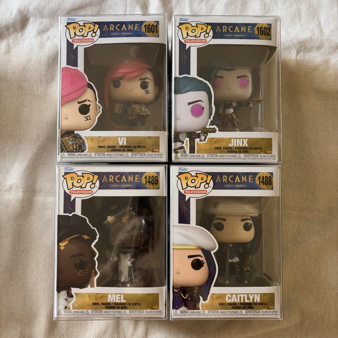 Funko Pop! Arcane Figures - Vi, Jinx, Mel, Caitlyn (Category: Designer & Blind Box Toys) located in Silang. Submitted by delulubean (Listing ID 1424715027, Image 1). Description: Funko Pop! Arcane Figures - Vi, Jinx, Mel, Caitlyn - Original and NOOB - Comes with Protectors - Lalamove or J&T delivery (c/o buyer) - Gcash Payment 📍Silang, Cavite.