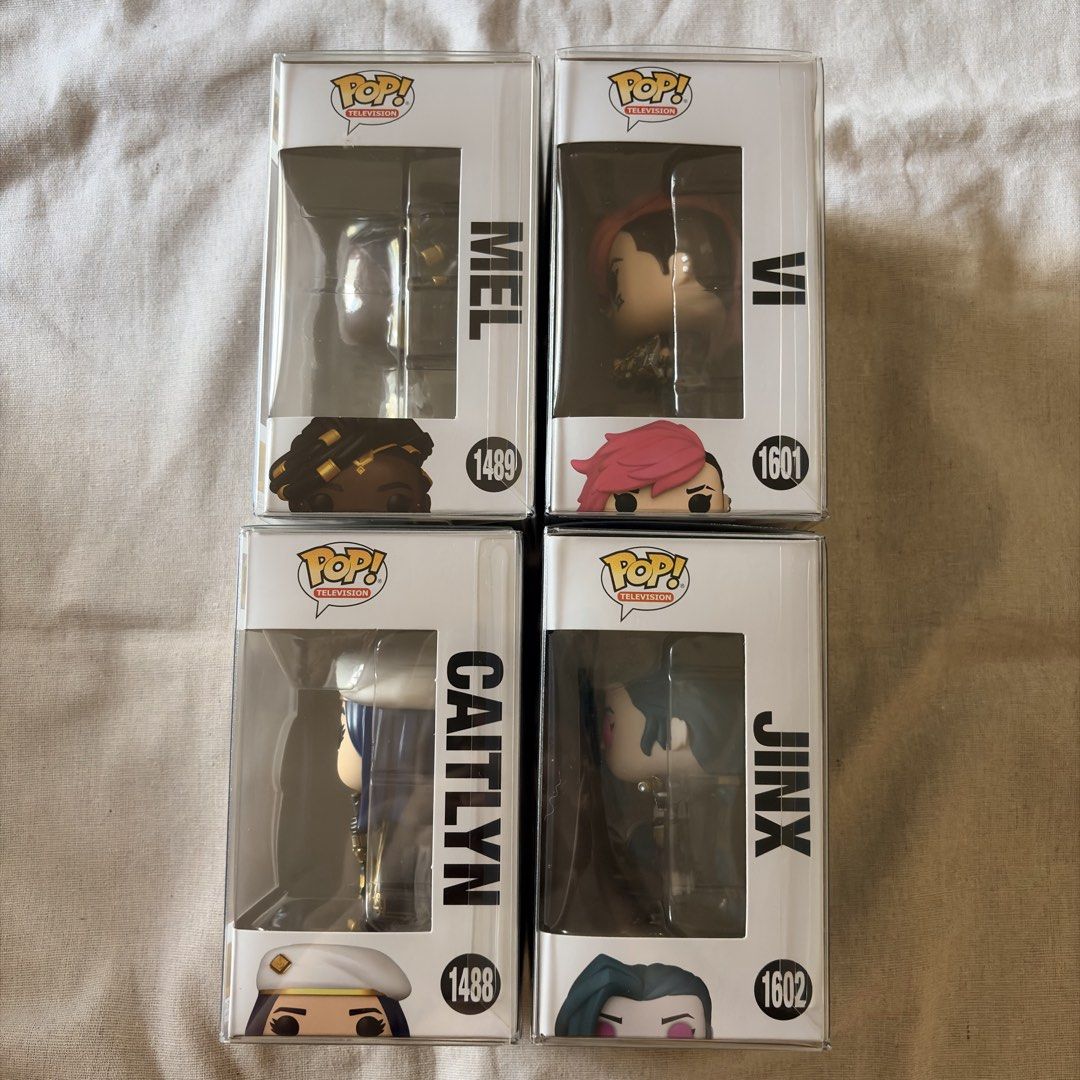 Funko Pop! Arcane Figures - Vi, Jinx, Mel, Caitlyn (Category: Designer & Blind Box Toys) located in Silang. Submitted by delulubean (Listing ID 1424715027, Image 3). Description: Funko Pop! Arcane Figures - Vi, Jinx, Mel, Caitlyn - Original and NOOB - Comes with Protectors - Lalamove or J&T delivery (c/o buyer) - Gcash Payment 📍Silang, Cavite.