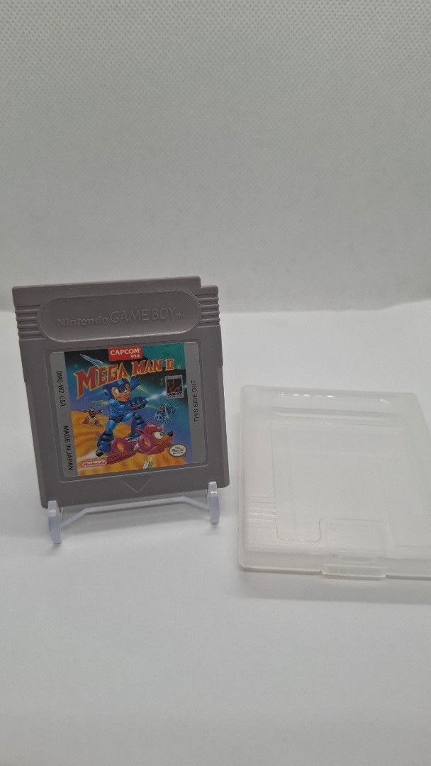Gameboy Mega-Man 2 with cartridge case protector (Category: Nintendo) located in San Juan City. Submitted by ricsgaragesale (Listing ID 1424776857, Image 1). Description: Mega-Man 2 Gameboy. Price: 2,500 PHP - Authentic. - Tested and working. - Pristine label condition and the cartridge case is in good condition, kindly check the pictures. - With 1 free authentic cartridge case protector. Issue: There's a slightly yellowish at the back of the car