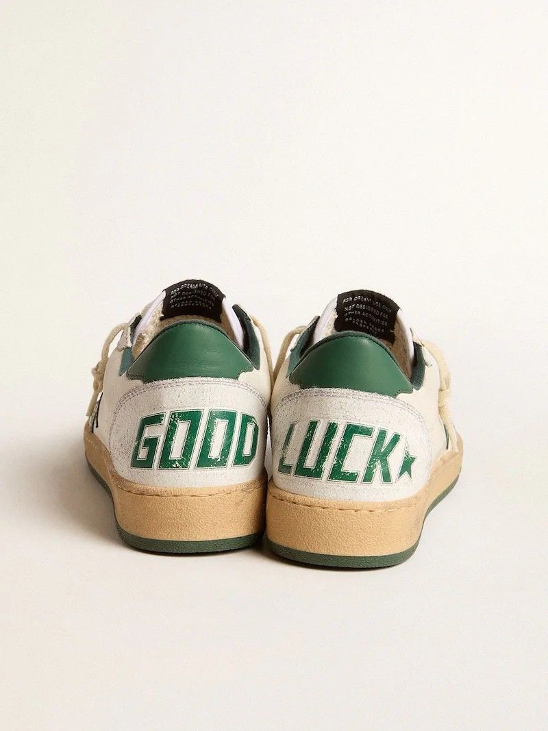 Golden Goose Ball Star Sneakers (Category: Sneakers) located in Manila. Submitted by sixthstreetsupply (Listing ID 1424865101, Image 3). Description: Stylish Golden Goose Ball Star sneakers. Features a cream-colored upper with various color accents and phrases on the heel. The soles are a light brown color. The sneakers have a classic lace-up design. Each pair has a unique design on the heel, including "DREAMING", "HAPPY DAY", "GOOD LUCK", and "L
