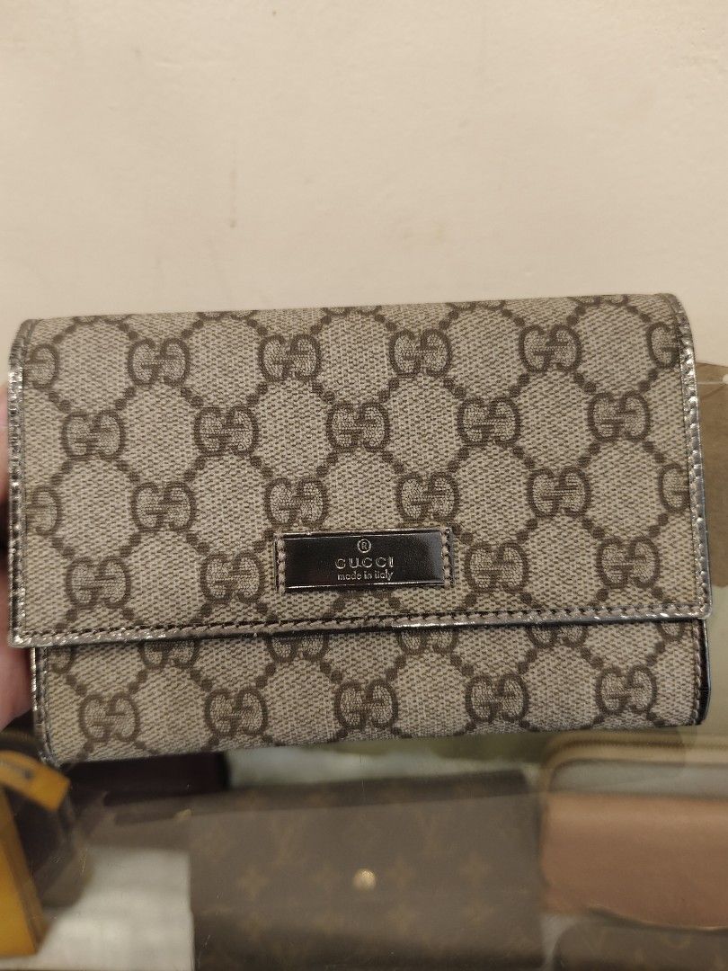 Gucci GG Supreme Wallet (Category: Luxury Bags & Wallets) located in Manila. Submitted by rhian_1994 (Listing ID 1424750412, Image 1). Description: Authentic Gucci wallet featuring the iconic GG Supreme canvas. It has a silver-tone interior and multiple card slots. The wallet includes a coin compartment and a snap closure. The 'Gucci made in Italy' logo is visible on the front. The serial number is 190381 496334..