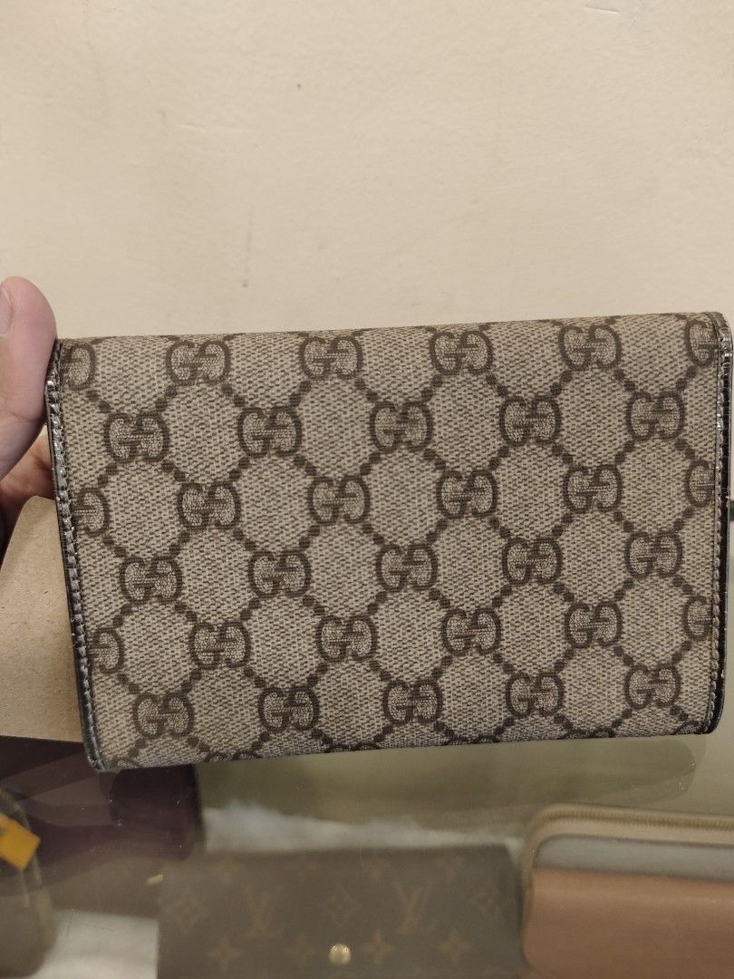 Gucci GG Supreme Wallet (Category: Luxury Bags & Wallets) located in Manila. Submitted by rhian_1994 (Listing ID 1424750412, Image 2). Description: Authentic Gucci wallet featuring the iconic GG Supreme canvas. It has a silver-tone interior and multiple card slots. The wallet includes a coin compartment and a snap closure. The 'Gucci made in Italy' logo is visible on the front. The serial number is 190381 496334..