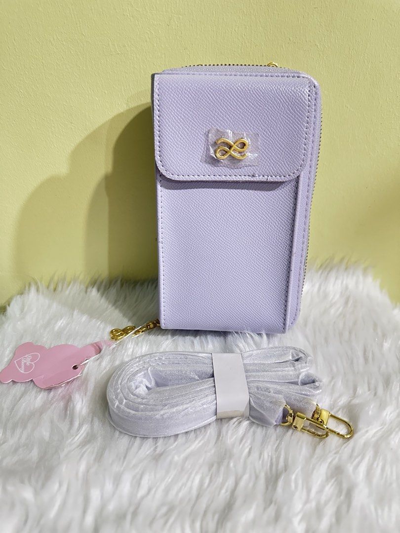 HOLB Lilac Cellphone/Wallet Bag with Strap (Category: Cross-body Bags) located in Manila. Submitted by amethyste_ph (Listing ID 1417853922, Image 1). Description: - Lilac cellphone bag - Flap closure with gold-colored logo - Detachable strap - Zippered compartment - Card slots and additional storage inside - Comes with tag and original packaging.