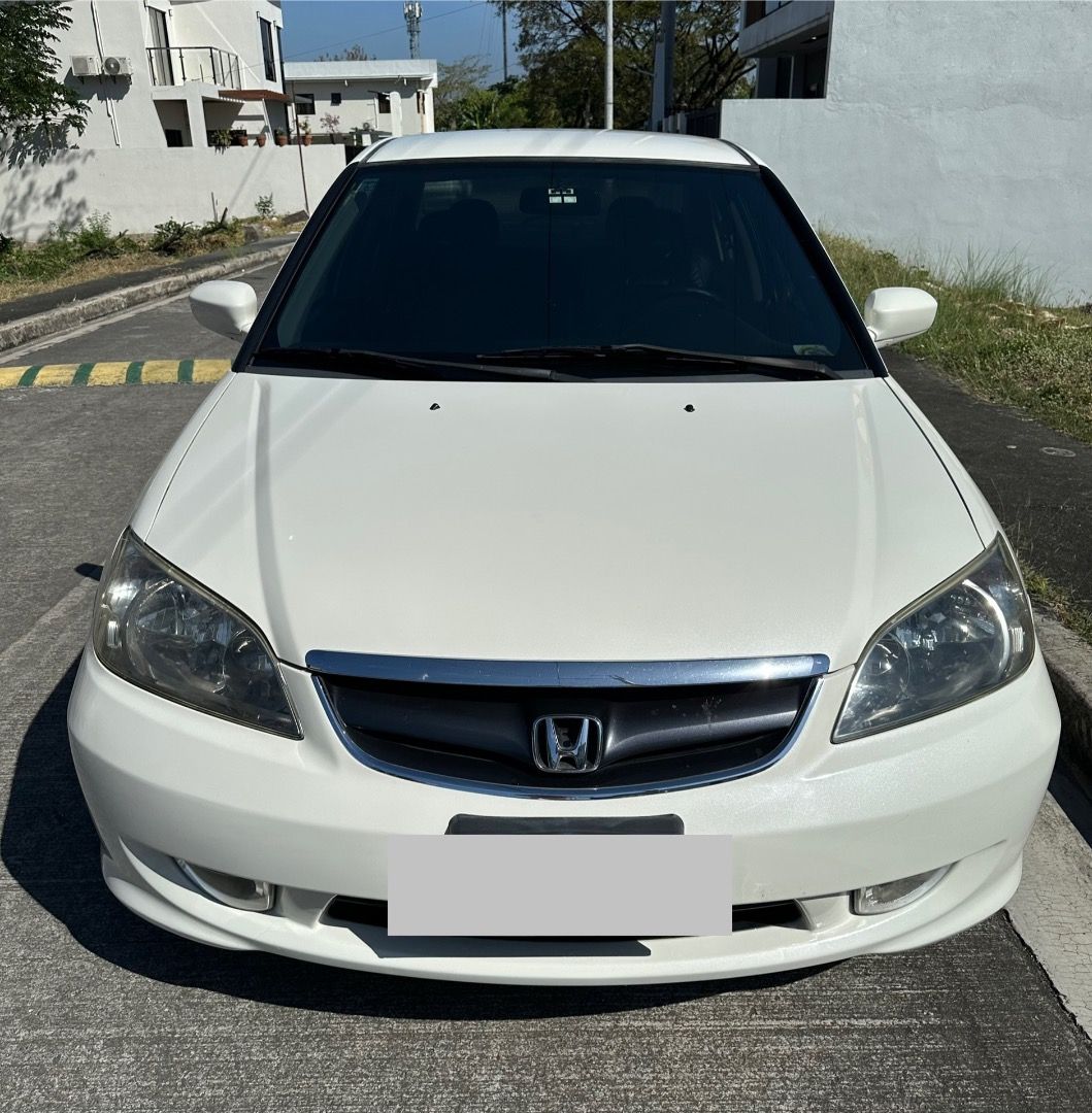 Honda Civic 2.0 (A) (Category: Used Cars) located in Makati City. Submitted by leeyumgee (Listing ID 1424733132, Image 2). Description: Fresh in and out All stock Upgraded to 16-inch OEM mags with Goodyear tires Top of the line 2.0 variant (K20 DOHC i-VTEC healthy engine) Smooth Automatic Transmission Auto-climate control, very cold aircon Shiny Pearl White Mica color Brand new CV joints both side, bushings, front wheel bearing, engine support Ke