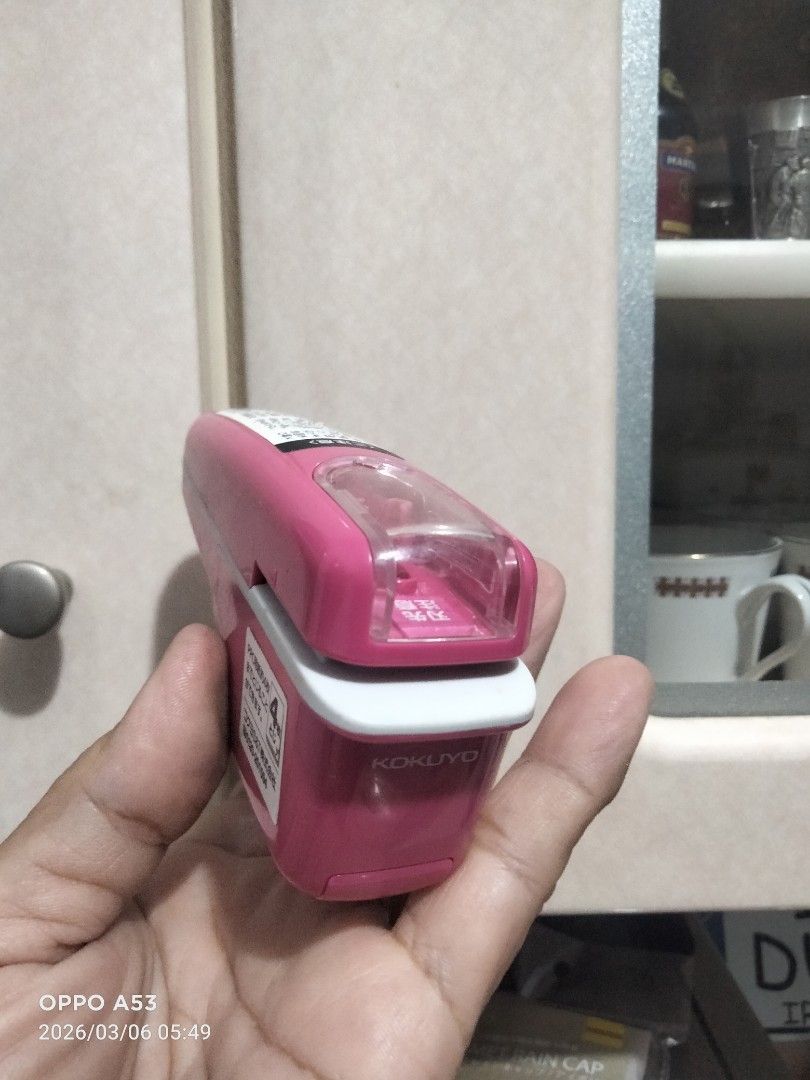 Kokuyo Harinacs Staple-Less Stapler (Category: Stationery & School Supplies) located in Carmona. Submitted by rpute (Listing ID 1424877375, Image 2). Description: Pink Kokuyo Harinacs staple-less stapler. The stapler is designed to bind papers without the need for staples. It has a simple, ergonomic design for easy use. The images show the stapler from various angles, highlighting its features and design..