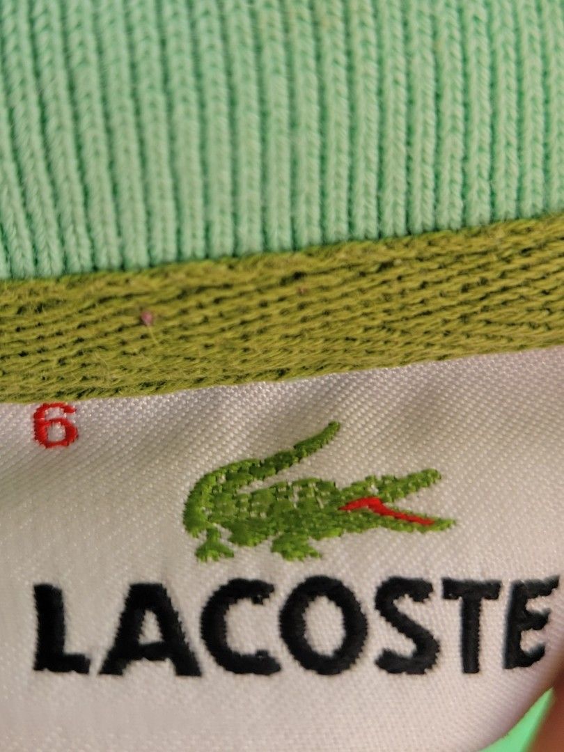 Lacoste Green Polo Shirt (Category: Tshirts & Polo Shirts ) located in Quezon City. Submitted by pasimple.698 (Listing ID 1424758165, Image 2). Description: Authentic Lacoste polo shirt in a refreshing green color. Features the iconic Lacoste crocodile logo on the chest. It has a classic polo collar and button-up closure. A great addition to any wardrobe for a casual yet stylish look..