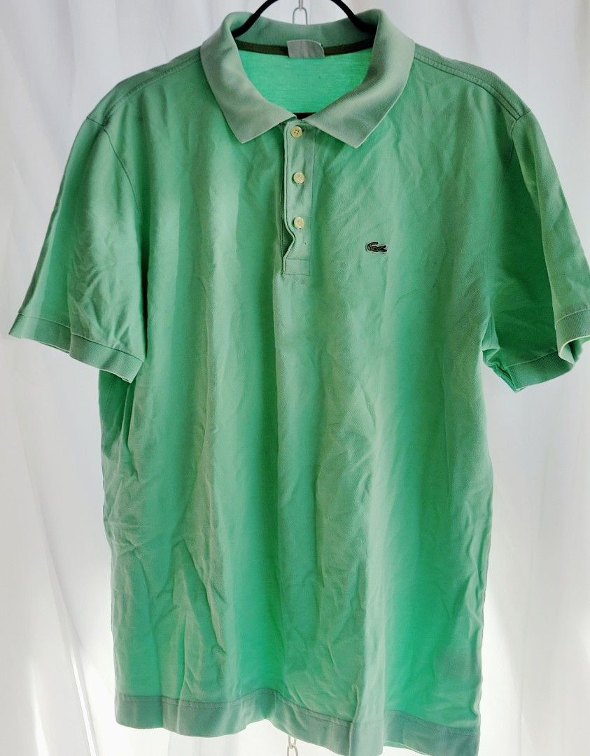 Lacoste Green Polo Shirt (Category: Tshirts & Polo Shirts ) located in Quezon City. Submitted by pasimple.698 (Listing ID 1424758165, Image 1). Description: Authentic Lacoste polo shirt in a refreshing green color. Features the iconic Lacoste crocodile logo on the chest. It has a classic polo collar and button-up closure. A great addition to any wardrobe for a casual yet stylish look..