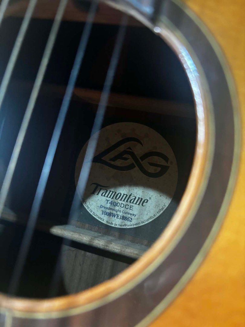 LAG Tramontane Acoustic Electric Guitar (Category: Musical Instruments) located in Cabuyao City. Submitted by cy_127 (Listing ID 1424810593, Image 3). Description: LAG Tramontane T400DCE Acoustic-Electric Guitar Well Maintained Message me for more details and if you’re interested. 😊.