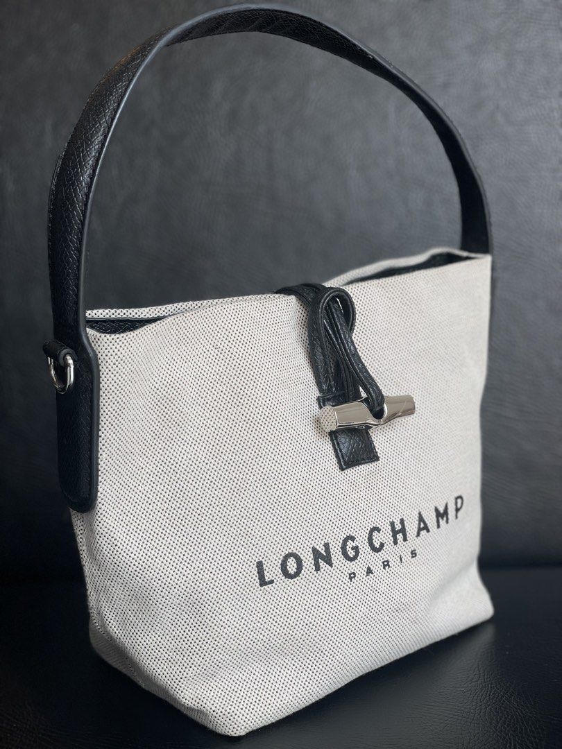 Longchamp Paris Handbag (Category: Luxury Bags & Wallets) located in Manila. Submitted by walter_wt (Listing ID 1424764905, Image 2). Description: Longchamp Roseau Canvas & Leather Bucket Bag in Metallic | -Condition rate: 9/10 .