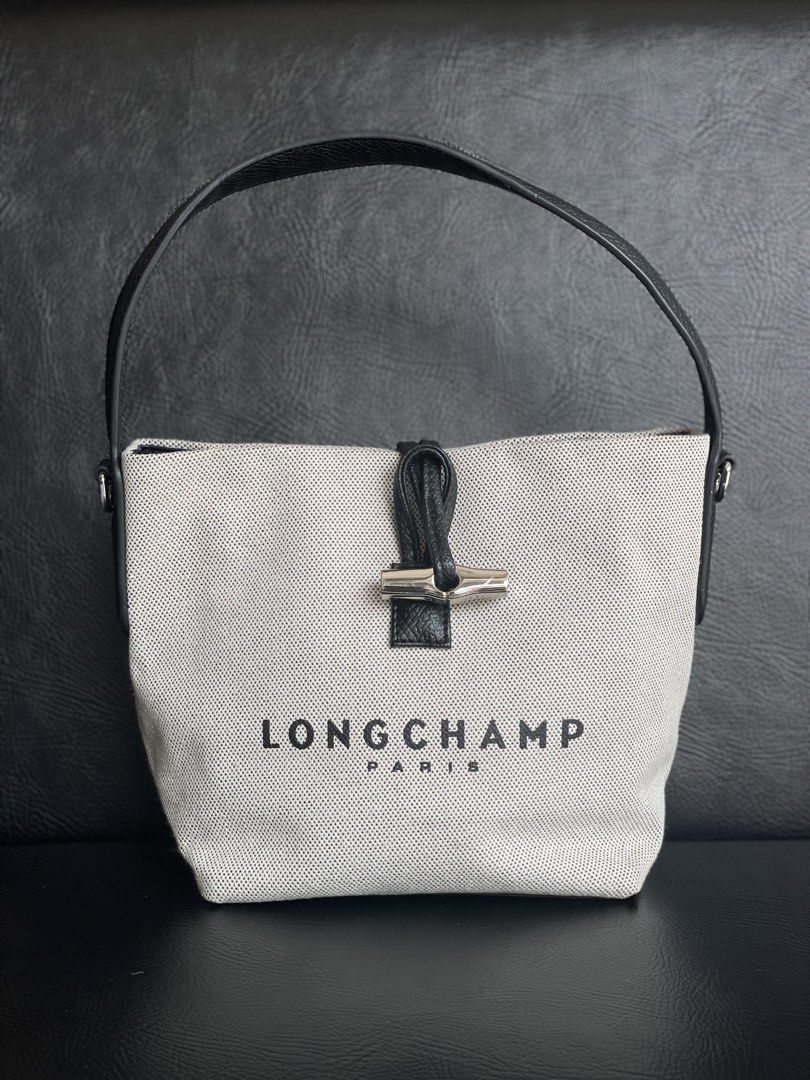 Longchamp Paris Handbag (Category: Luxury Bags & Wallets) located in Manila. Submitted by walter_wt (Listing ID 1424764905, Image 1). Description: Longchamp Roseau Canvas & Leather Bucket Bag in Metallic | -Condition rate: 9/10 .